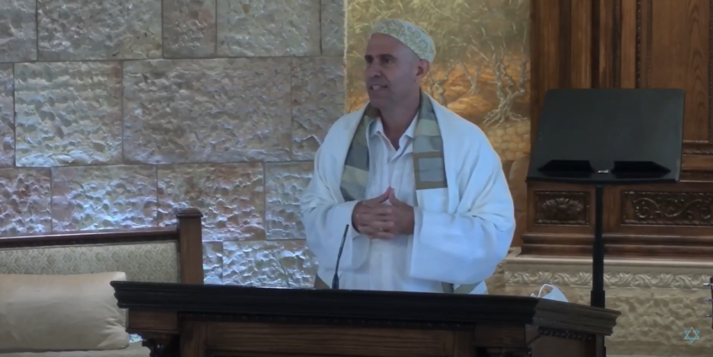 Image of K'vod delivering a sermon on 'Navigating Anti Semitism RH Sermon 2021' YouTube video.